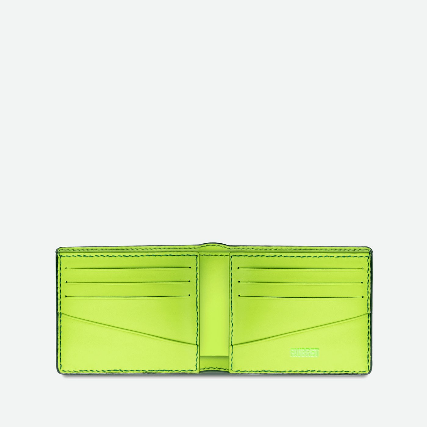 Intérieur en cuir lisse fluo et surpiqures verte.