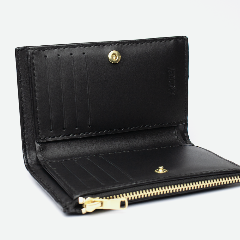 Intérieur du porte-carte femme FAUBRET en cuir noir avec emplacements pour cartes et bouton pression